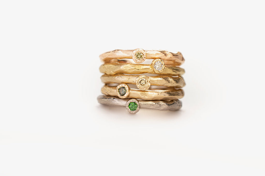 stacked rings with colored diamonds in recycled gold by Liesbeth Busman
