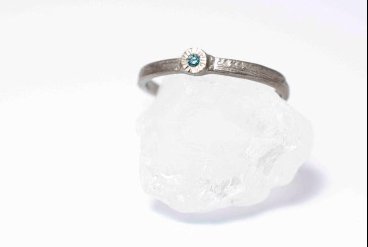 Earth Ærth handmade wedding ring that has a natural structure that resembles earth and weathered valleys.