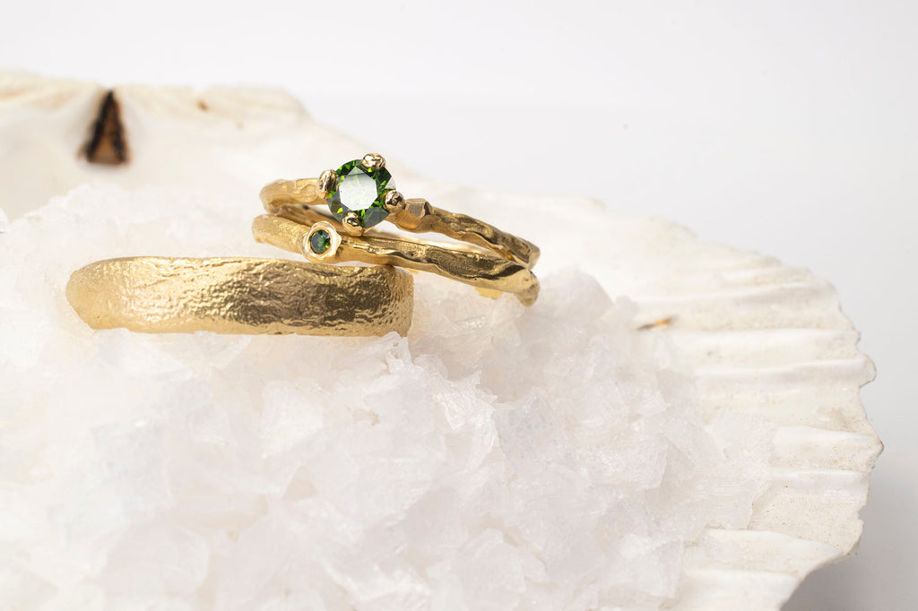 gold rings on a shell with crystals